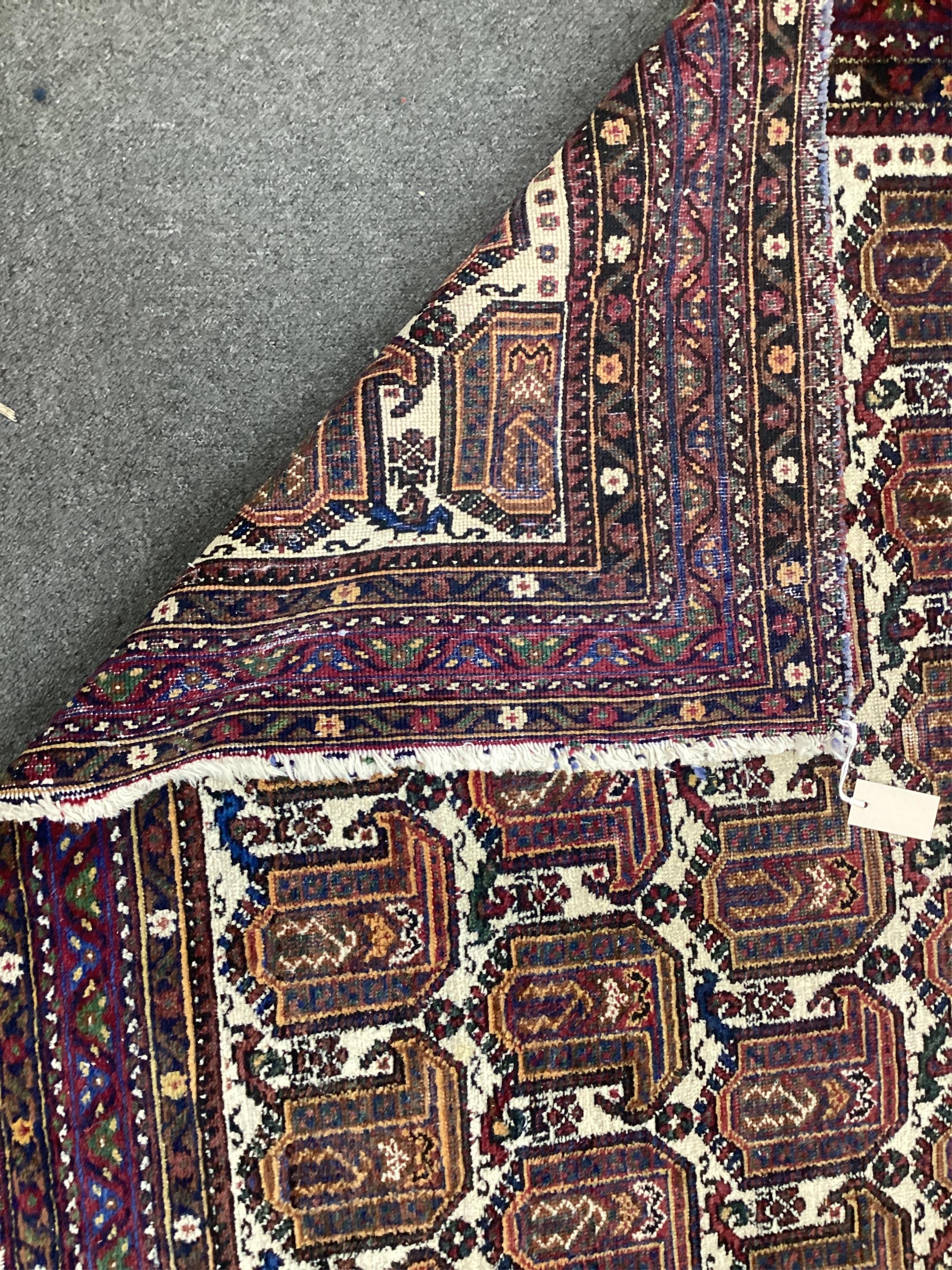 An Afshar ivory ground rug, 200 x 156cm. Condition - fair